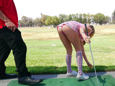 Karla Kush teasing her golf instructor with her short skirt